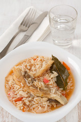 rice with fish on the white plate