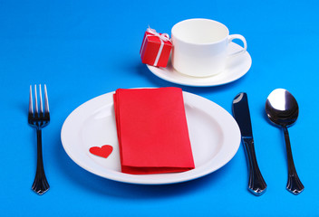 Table setting on blue background