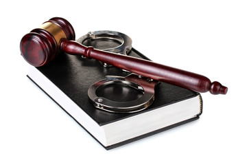 wooden gavel, handcuffs and book isolated on white