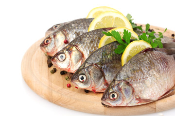 Fresh fishes with lemon, parsley and spice