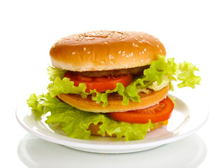 Big and tasty hamburger on plate isolated on white
