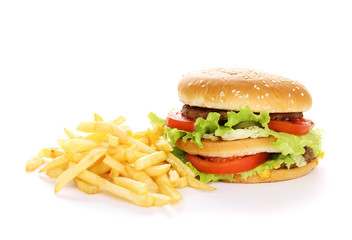 Big and tasty hamburger and fried potatoes isolated on white