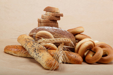 Fresh bread isolated on a light brown background.