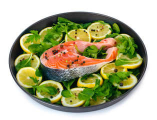 Red fish with lemon, parsley and pepper