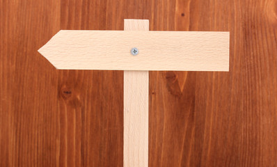 Wooden signboard on wooden background