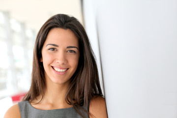 Portrait of beautiful businesswoman standing in hall