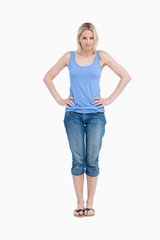 Fototapeta premium Blonde woman placing her hands on her hips