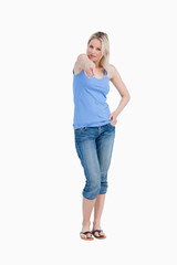 Relaxed blonde woman pointing her finger