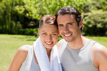 Obraz premium woman with and man smiling in workout gear