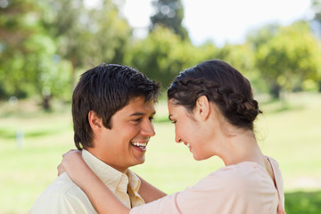Fototapeta premium Two friends laughing as they hold each other