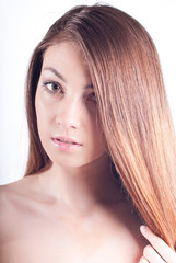 beautiful woman enjoying long brown hair and clean skin