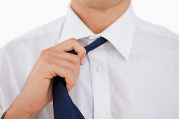 Close-up of a man undoing his tie