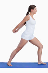 Fototapeta premium Smiling woman stretching her arms while standing upright