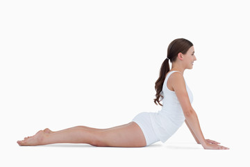 Young brunette practicing gymnastics