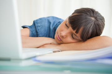 Female student sleeping on her desk