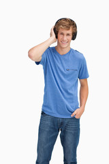 Fototapeta premium Smiling blond man wearing headphones