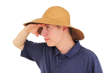 Young man with  straw hat watching at the distance
