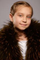 Smiling girl blonde in fur coat