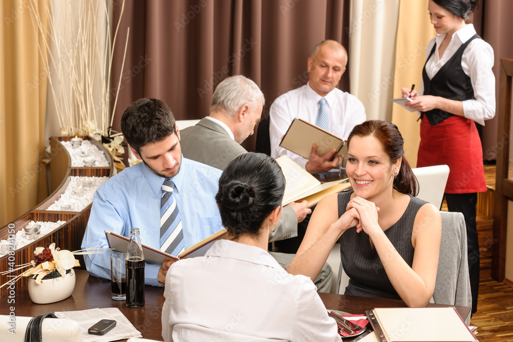 Wall mural Business lunch executives look menu restaurant