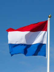 Dutch flag against the blue sky
