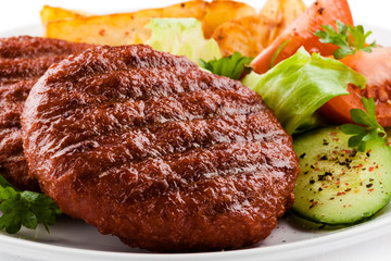 Grilled beefsteak, baked potatoes and vegetables