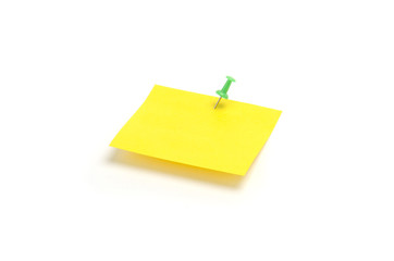 Yellow reminder note with green pin isolated on the white