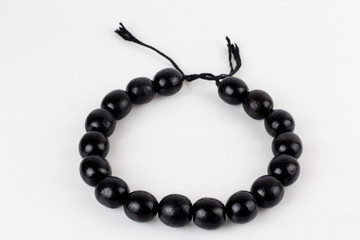 round black beads on white background