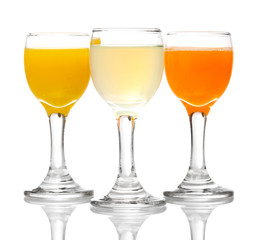Tropical juices in glasses isolated on white