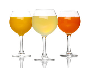 Tropical juices in glasses isolated on white