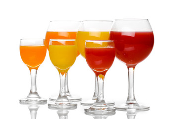 Tropical juices in glasses isolated on white