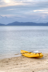Fototapeta na wymiar Colourful kayaks on the beach