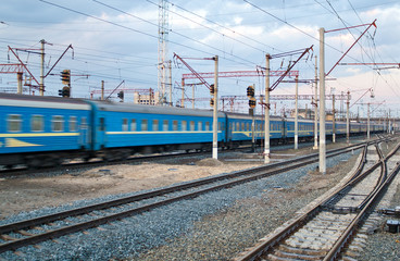 Fototapeta na wymiar Passanger train passing the station