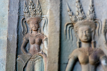 carved apsara dancers