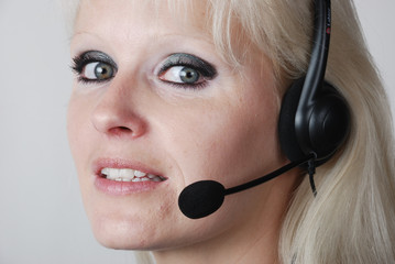 Portrait of young woman with headset