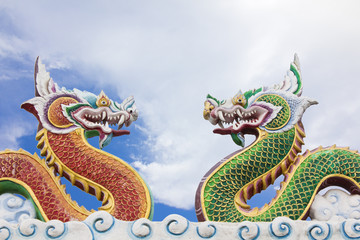 Chinese dragon statue on blue sky background