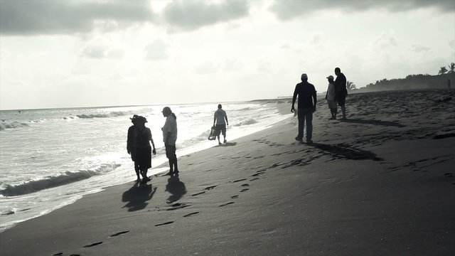 People on the beach in black and White