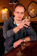 Man with a beer giving a toast