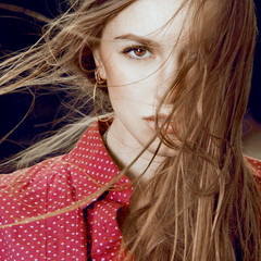 Closeup of beautiful expression woman with flaying hair