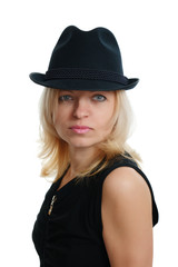 serious woman with a black hat