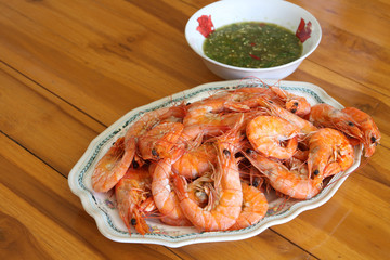 Steamed shrimp in dish on the table with seafood sauce
