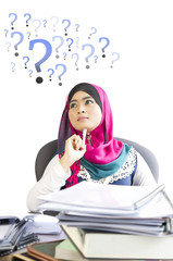 Young business woman thinking about something at her office