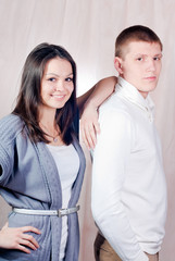 Young happy couple in studio
