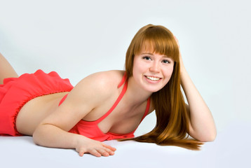 Obraz premium Beautiful redheaded woman in a swimsuit