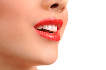 Obraz premium Close-up shot of woman lips with glossy red lipstick
