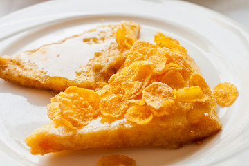 Bread topped with honey on a white dish