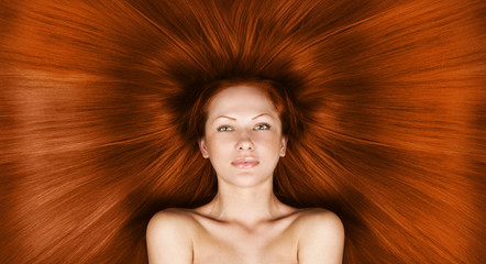 woman with long healthy shiny red hair