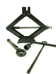 Car jack and basic tool over the white background
