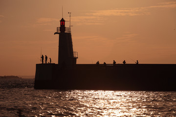 Fototapeta premium Lighthouse and jetty, St Malo, France
