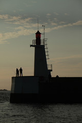 Fototapeta premium Lighthouse and harbour jetty, St Malo, France