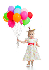 Funny child girl  with bunch of colorful ballons in her hand. Is